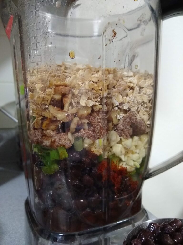 finely chopped oats, beans and peppers in a blender