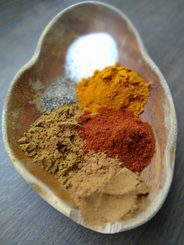 Brightly colored spices for vegan lentil chickpea stew