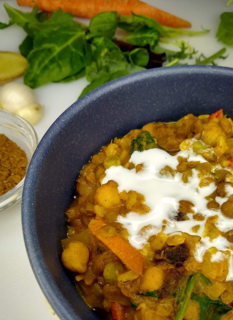 A creamy and crunchy one pot lentil stew with coconut cream on top
